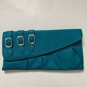 Migtigne clutch blue leather new with tags